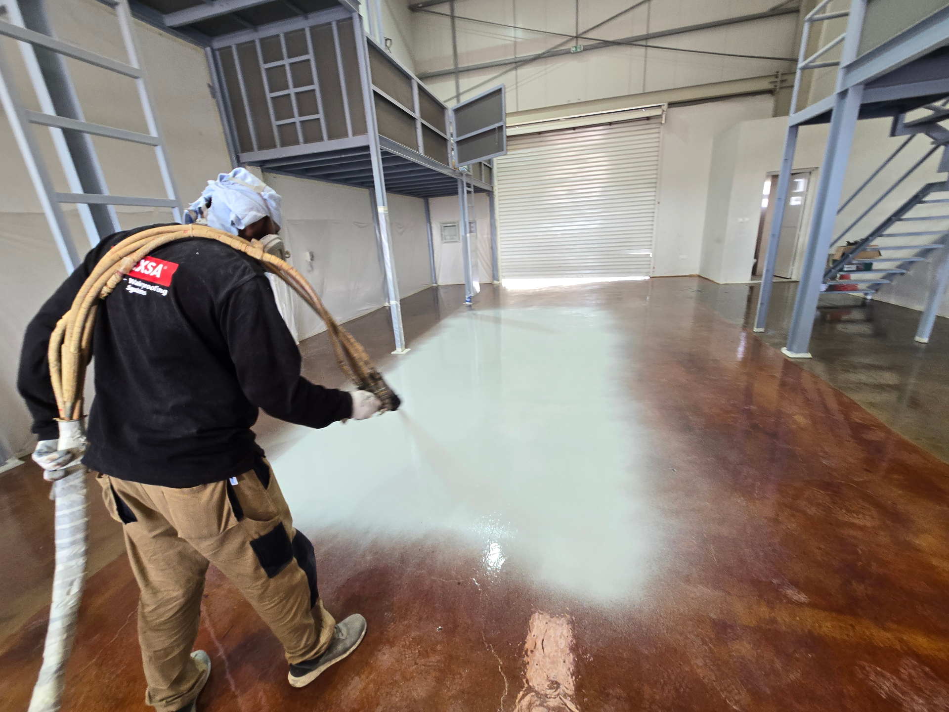 Industrial epoxy resin flooring in a warehouse