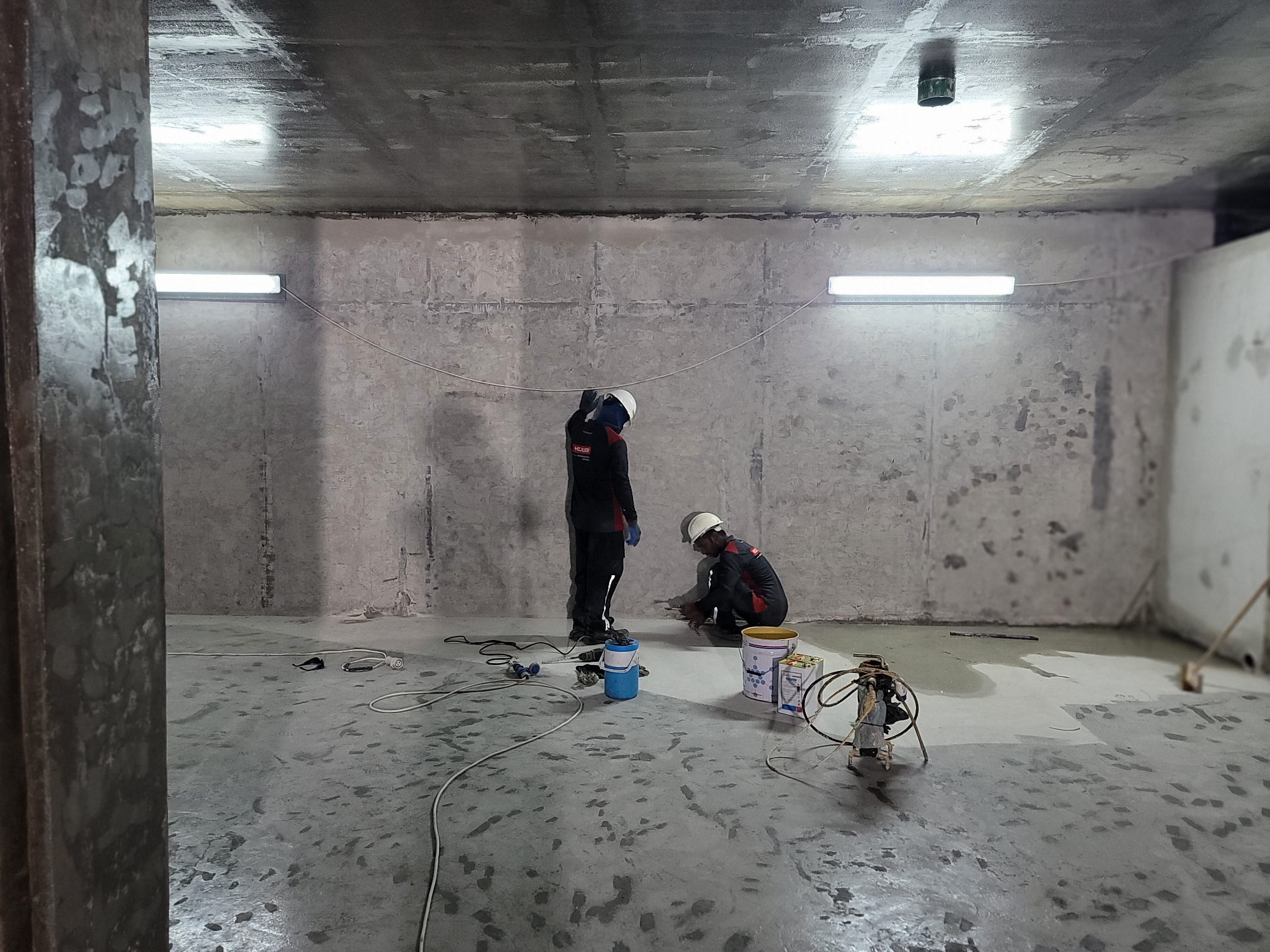 Polyurethane injection ports installed in a concrete crack