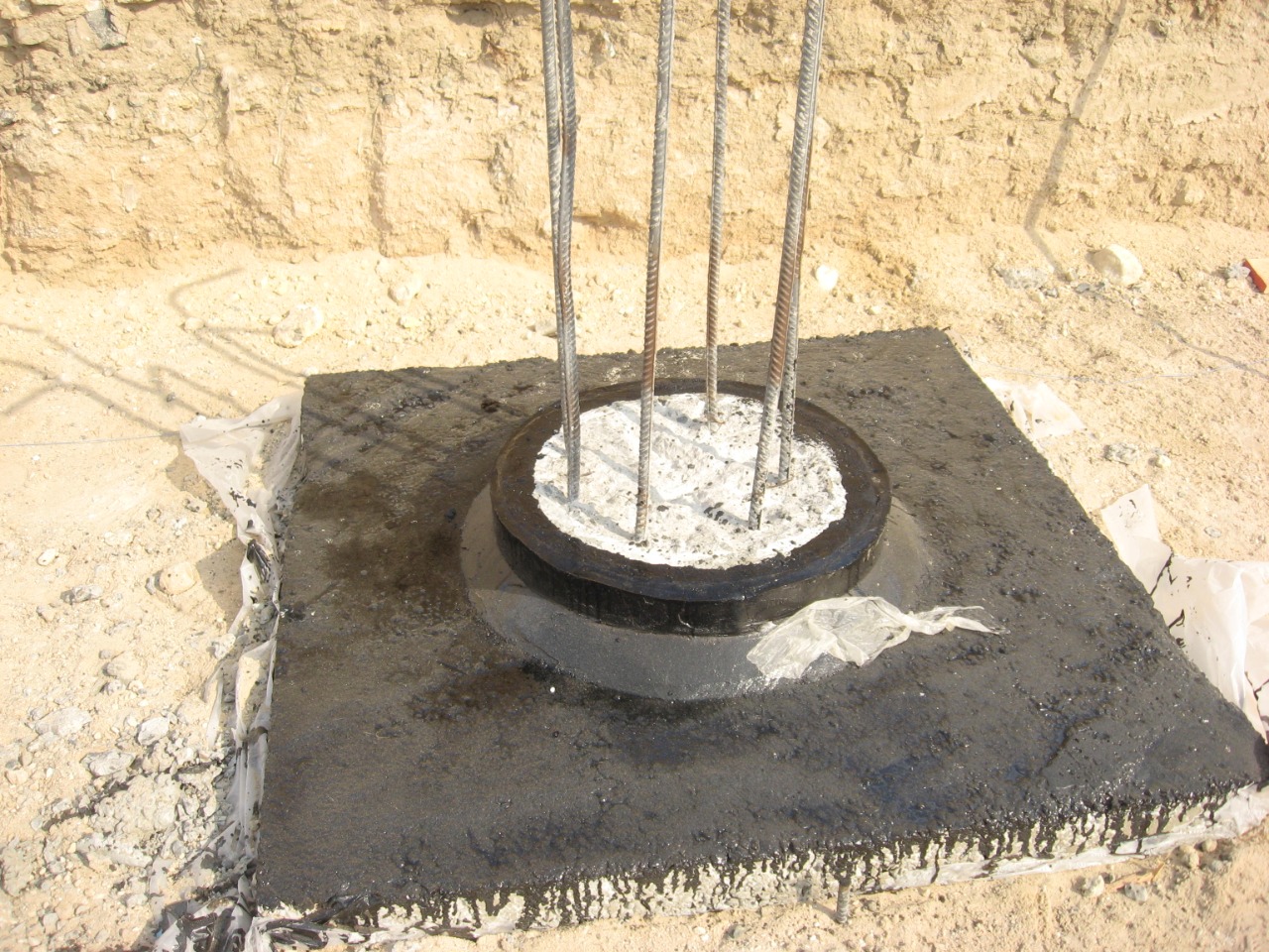 Bitumen membrane wrap around pile head with rebar cage